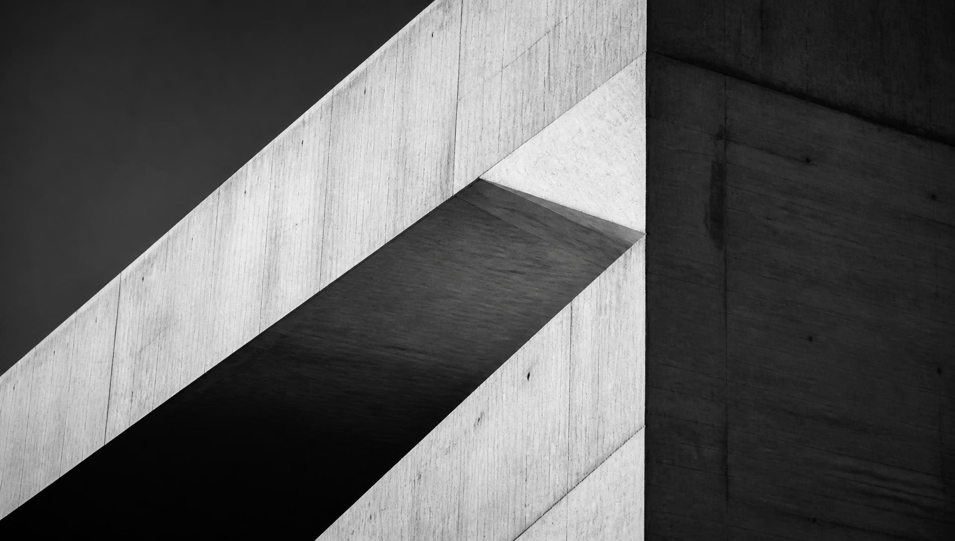 Abstract black and white photograph of an intersecting concrete structure